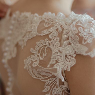 woman wearing white sheer lace wedding gown