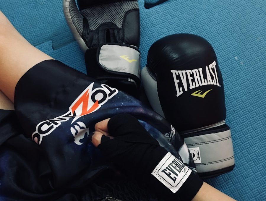 a pair of boxing gloves laying on top of a blue floor