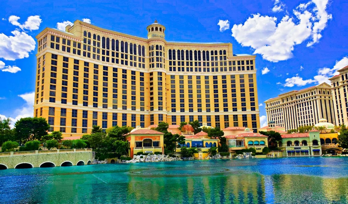 a large building with a fountain in front of it