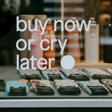 assorted-color sock lot displayed behind glass window